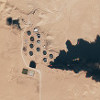 Égő olajtározók Líbiában